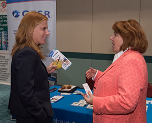 GFSR’s CEO Tina Brillinger speaks with a participant at the 2016 SQF International conference