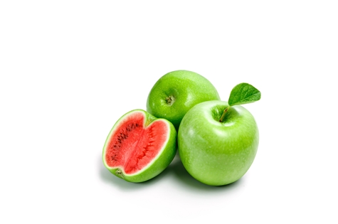 Green apple watermelon on white background, isolate. A product of genetic engineering, genetically modified fruit.